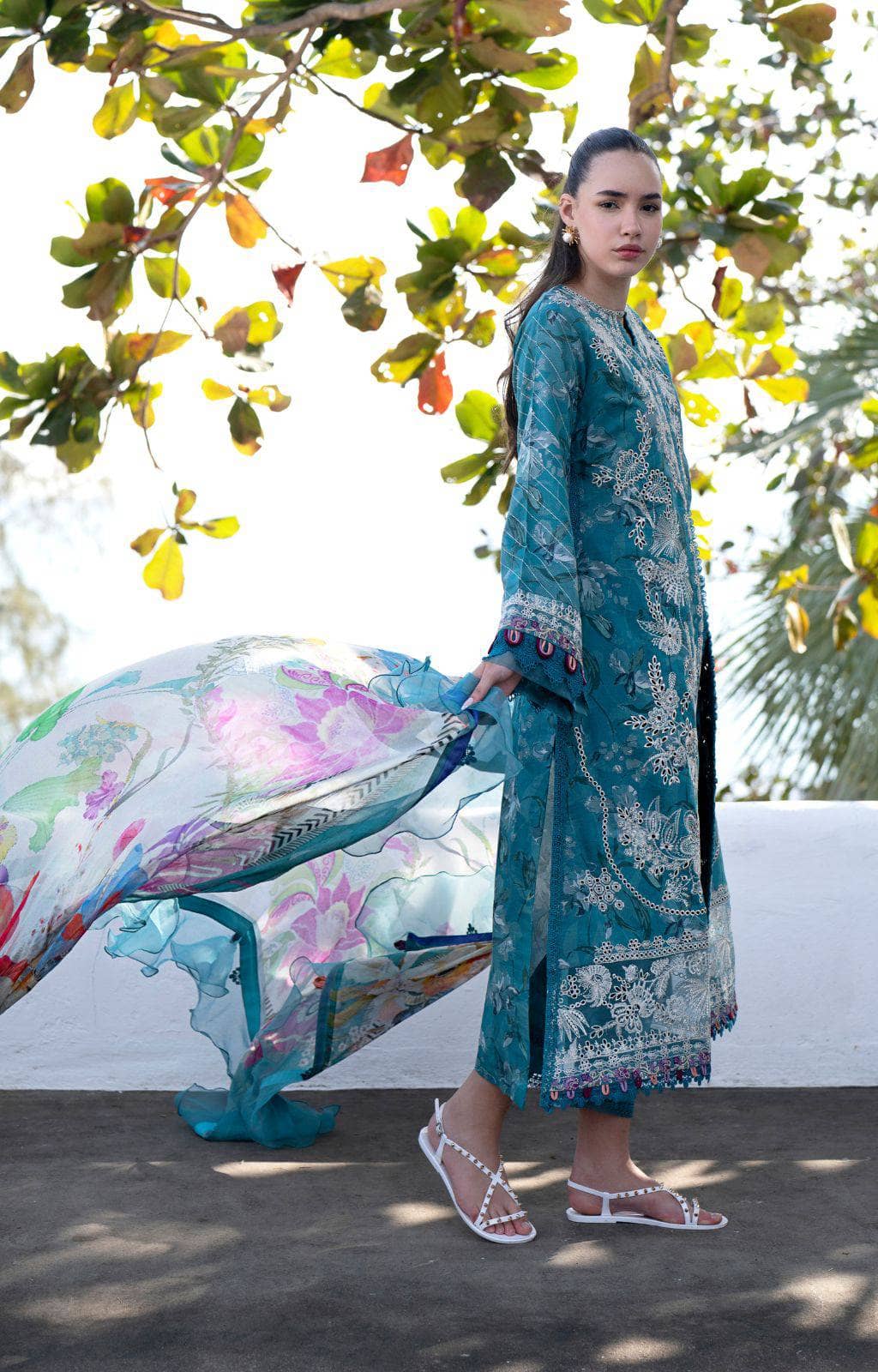 Let us unveil a vision of subtle grace – Glory! 💚 Subtle sophistication meets intricate detail. A zinc green self-printed canvas is adorned with chikankari embroidered composed panels and exquisite embroidered borders (colored and ivory threads!). Embroidered sleeve borders add to the refinement. Finished with dyed cambric trousers and a printed chiffon dupatta. Glory: Understated elegance, perfected.