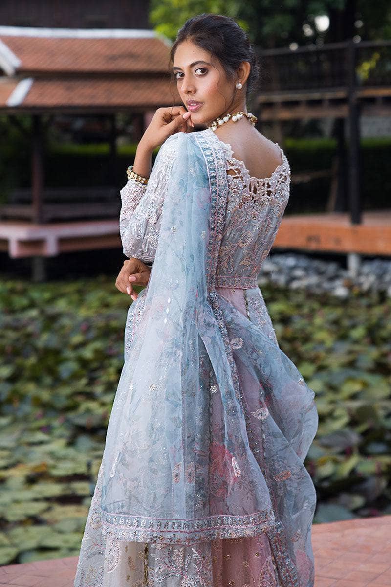 Indulge in elegance with this stunning outfit, featuring hand-embellished embroidery and sequins on the front yoke, back yoke, sleeves, and front panels. The ensemble is completed with a raw silk trousers, and a dupatta adorned with exquisite organza lace and borders, accented by exclusive handmade sleeve tassels and golden samosa lace for a luxurious and refined finish. Package Details: Embroidered, sequinned & hand embellished front yoke Embroidered & sequinned back yoke & sleeves Embroidered & seq