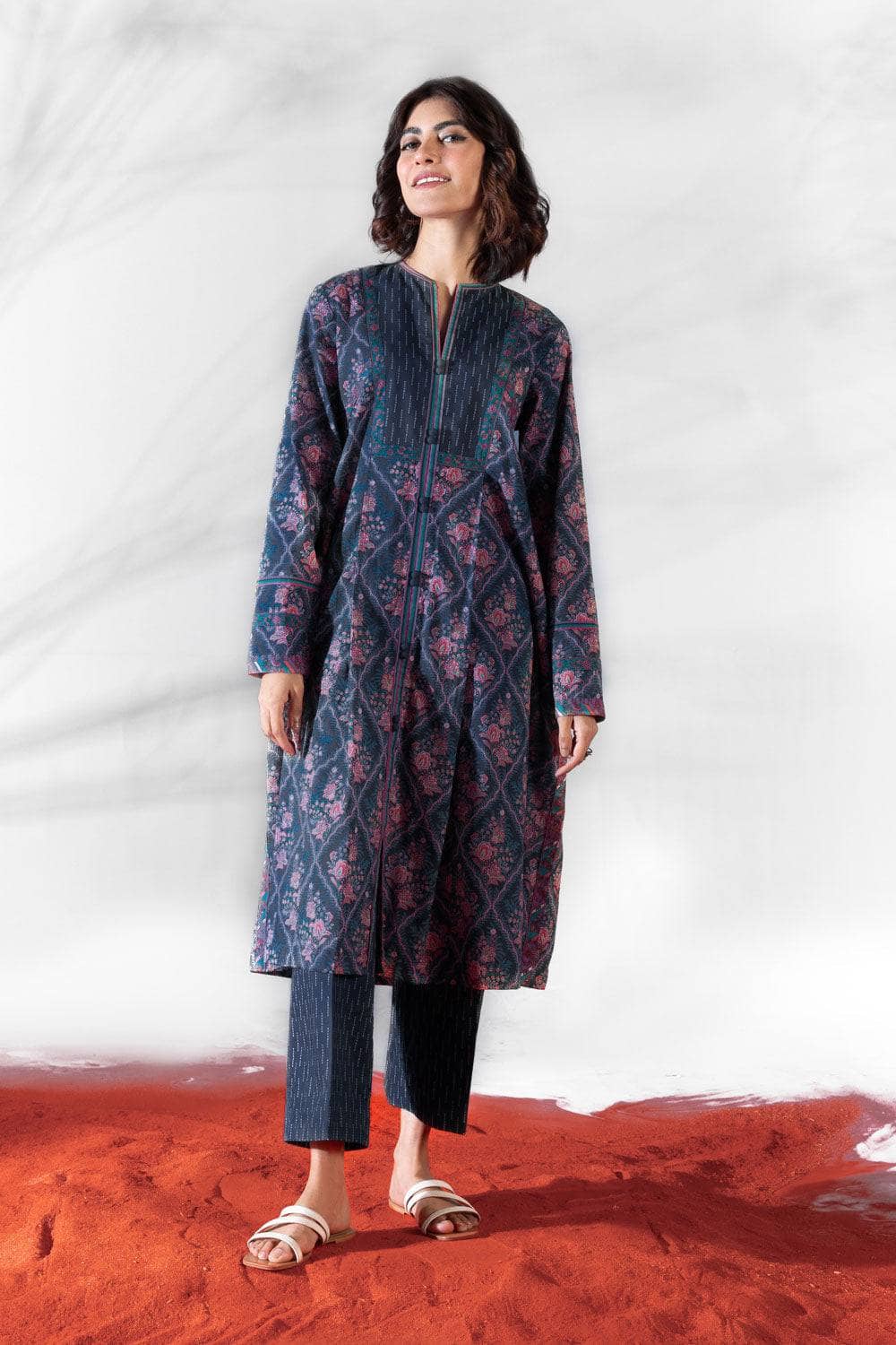 Don't be afraid to make a splash in this colourful geometric print! This unstitched three piece outfit features a lightly embroidered printed lawn shirt, voile dupatta and cotton trousers. Product Detail Unstitched 3-Piece Shirt Embroidered Neckline 1PC Embroidered Border 1PC Printed Lawn Shirt 3M Fabric: Lawn Color: Multi