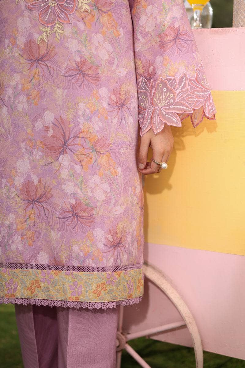 Person wearing a pink floral dress with a yellow background