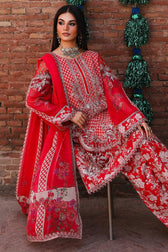 Red embroidered traditional outfit displayed against a brick wall with decorative elements.