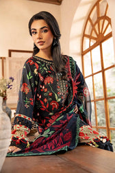 Woman wearing a traditional embroidered outfit in a well-lit room.