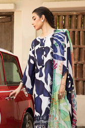 Woman in a patterned outfit opening a car door, with a decorative wooden gate in the background.