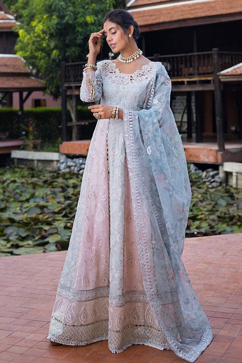 Indulge in elegance with this stunning outfit, featuring hand-embellished embroidery and sequins on the front yoke, back yoke, sleeves, and front panels. The ensemble is completed with a raw silk trousers, and a dupatta adorned with exquisite organza lace and borders, accented by exclusive handmade sleeve tassels and golden samosa lace for a luxurious and refined finish.       Package Details:  Embroidered, sequinned & hand embellished front yoke Embroidered & sequinned back yoke & sleeves Embroidered & seq