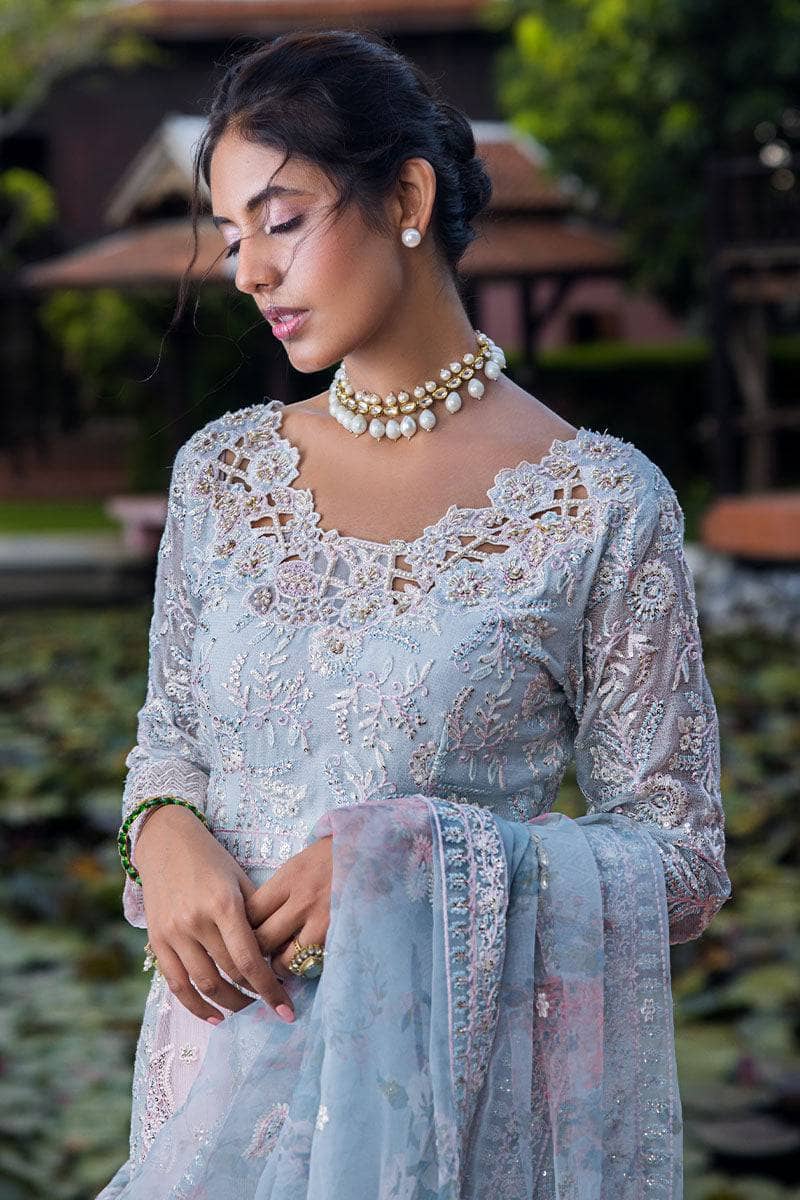 Indulge in elegance with this stunning outfit, featuring hand-embellished embroidery and sequins on the front yoke, back yoke, sleeves, and front panels. The ensemble is completed with a raw silk trousers, and a dupatta adorned with exquisite organza lace and borders, accented by exclusive handmade sleeve tassels and golden samosa lace for a luxurious and refined finish.       Package Details:  Embroidered, sequinned & hand embellished front yoke Embroidered & sequinned back yoke & sleeves Embroidered & seq