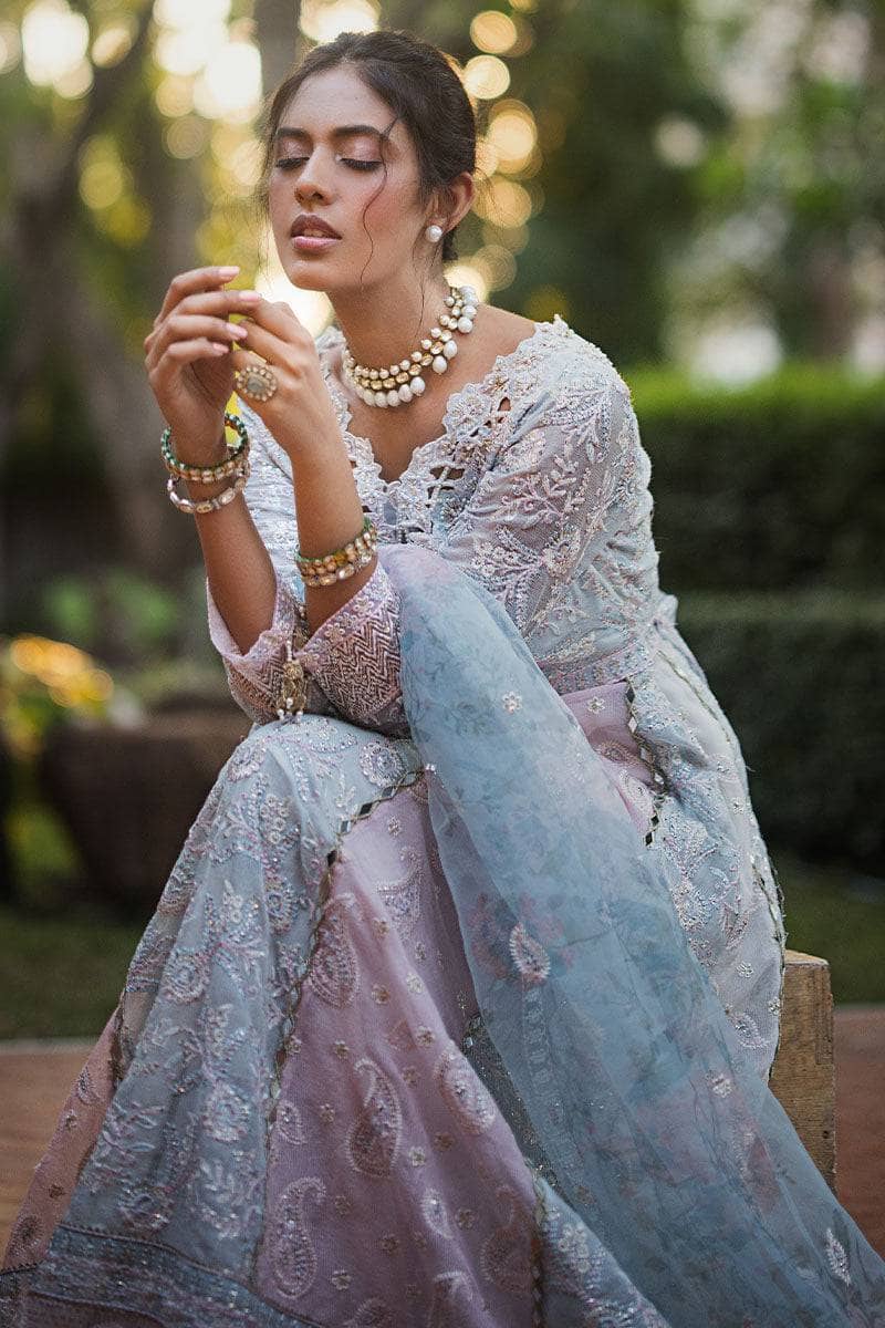 Indulge in elegance with this stunning outfit, featuring hand-embellished embroidery and sequins on the front yoke, back yoke, sleeves, and front panels. The ensemble is completed with a raw silk trousers, and a dupatta adorned with exquisite organza lace and borders, accented by exclusive handmade sleeve tassels and golden samosa lace for a luxurious and refined finish.       Package Details:  Embroidered, sequinned & hand embellished front yoke Embroidered & sequinned back yoke & sleeves Embroidered & seq