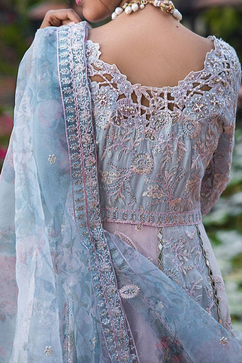 Indulge in elegance with this stunning outfit, featuring hand-embellished embroidery and sequins on the front yoke, back yoke, sleeves, and front panels. The ensemble is completed with a raw silk trousers, and a dupatta adorned with exquisite organza lace and borders, accented by exclusive handmade sleeve tassels and golden samosa lace for a luxurious and refined finish.       Package Details:  Embroidered, sequinned & hand embellished front yoke Embroidered & sequinned back yoke & sleeves Embroidered & seq