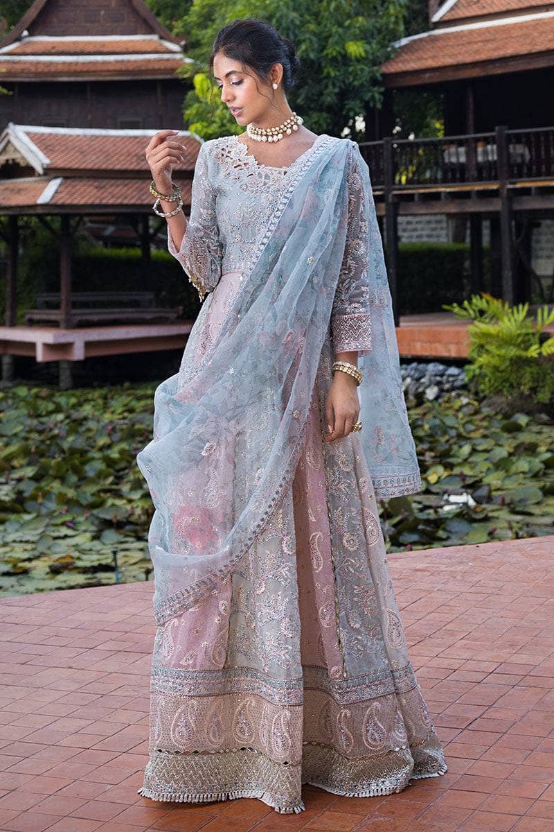 Indulge in elegance with this stunning outfit, featuring hand-embellished embroidery and sequins on the front yoke, back yoke, sleeves, and front panels. The ensemble is completed with a raw silk trousers, and a dupatta adorned with exquisite organza lace and borders, accented by exclusive handmade sleeve tassels and golden samosa lace for a luxurious and refined finish.       Package Details:  Embroidered, sequinned & hand embellished front yoke Embroidered & sequinned back yoke & sleeves Embroidered & seq