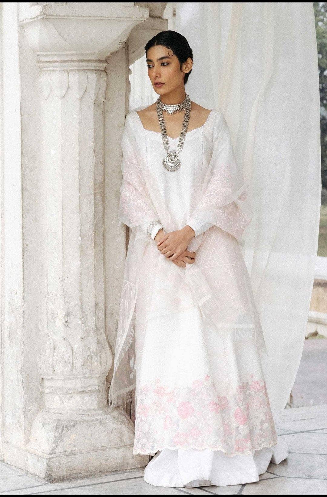 Fully embroidered shirt front with paste printed back and sleeves Embroidered border patch Laser cut embroidered organza dupatta Dyed cambric trouser