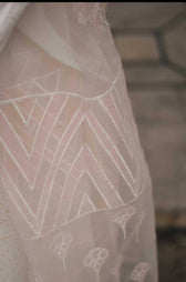 Fully embroidered shirt front with paste printed back and sleeves Embroidered border patch Laser cut embroidered organza dupatta Dyed cambric trouser